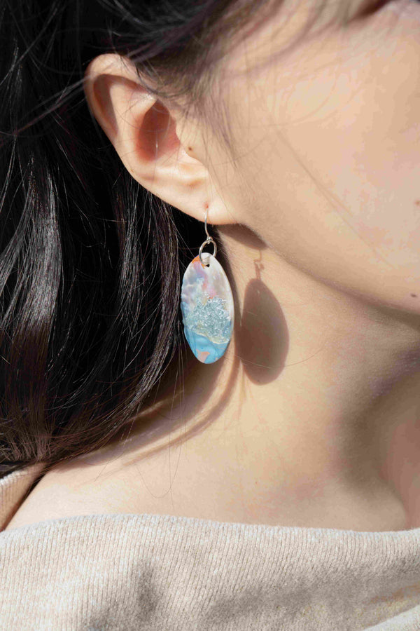 Artisan oriental drop earrings with abstract ocean blue glass design and watercolor inspired patterns