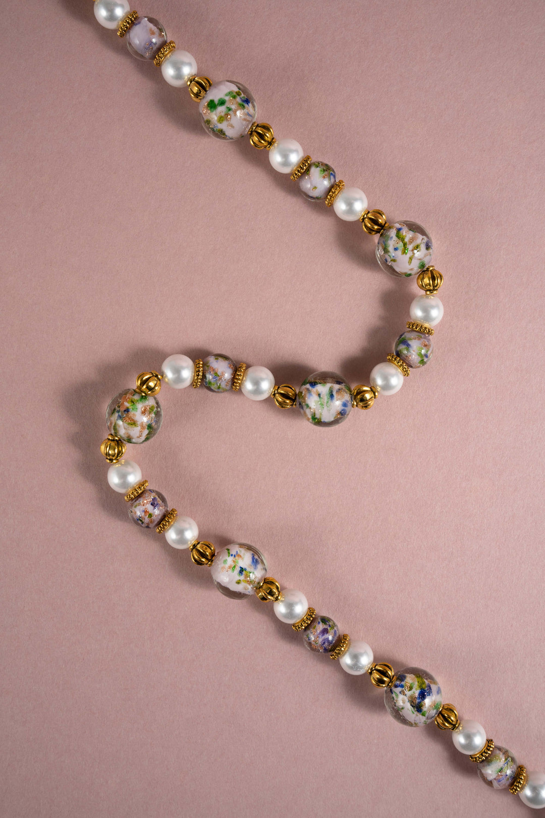Artisanal Oriental style Liuli glass flower bead necklace with freshwater pearls and retro gold details, vintage Eastern aesthetic statement jewelry.