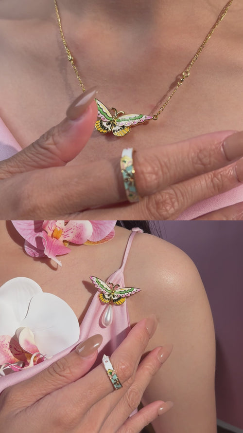 close-up of hand-painted enamel butterfly jewelry, 18k gold plated detail craftsmanship, Kyoto handmade designer jewelry texture and finish